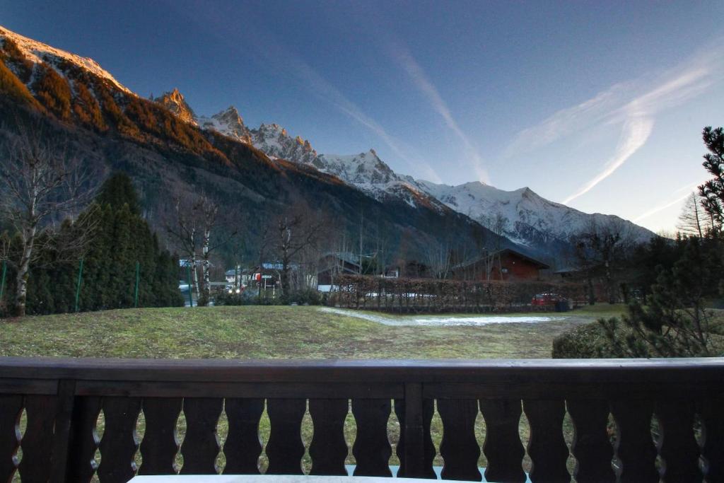 a view from the balcony of a house in the mountains at Chalet Ancelles - Les Praz - Golf - Vue Mont-Blanc - Randonnées in Chamonix