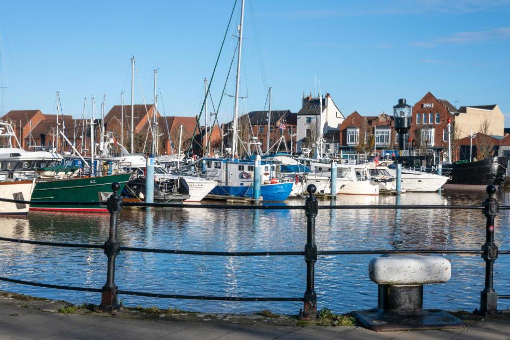 a group of boats docked in a harbor at Honey's Hideaway in Hull