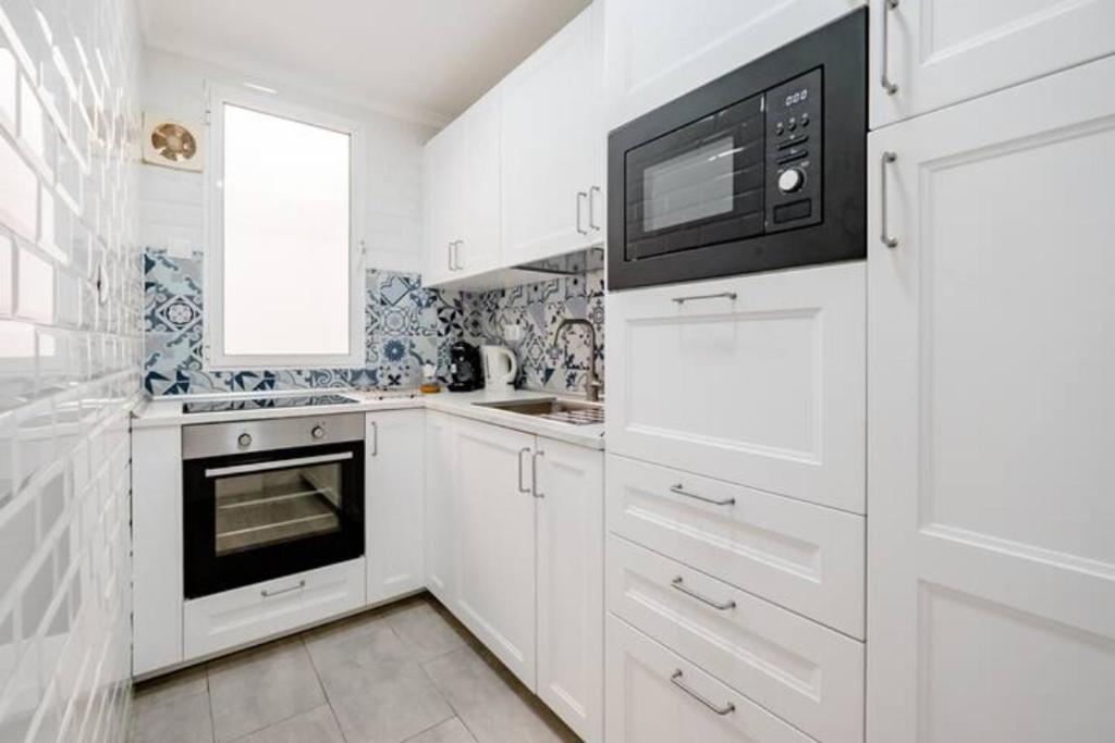 Kuchyňa alebo kuchynka v ubytovaní Apartamento Fuentecilla Céntrico
