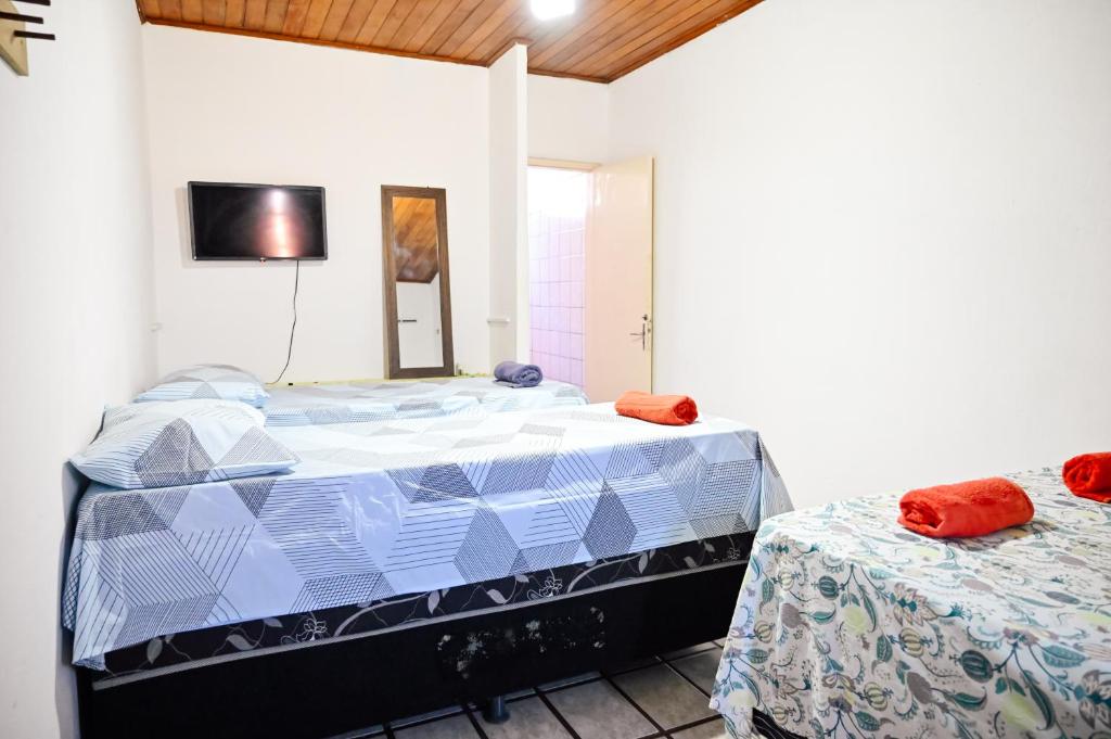 Postel nebo postele na pokoji v ubytování Hostel mineiros