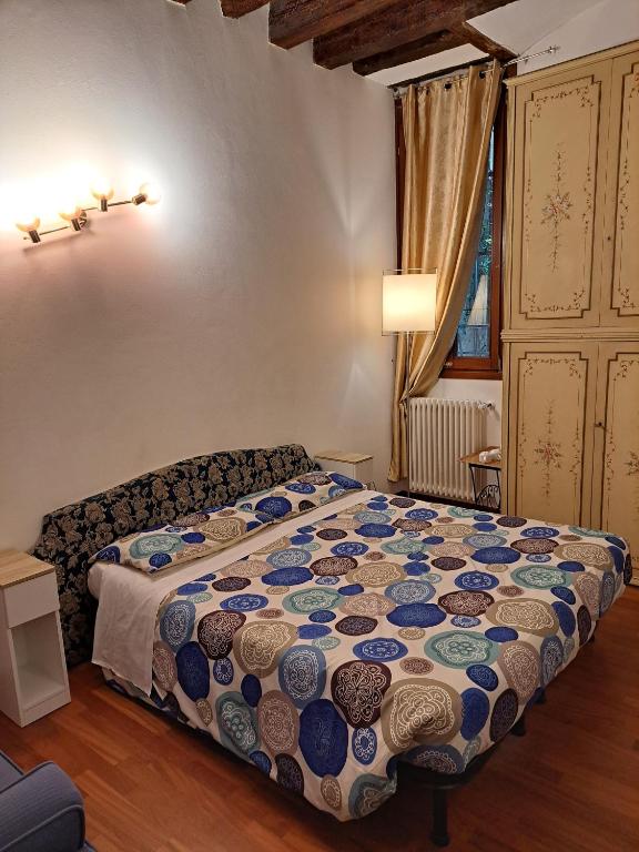 Postel nebo postele na pokoji v ubytování Locanda Ca' Formosa