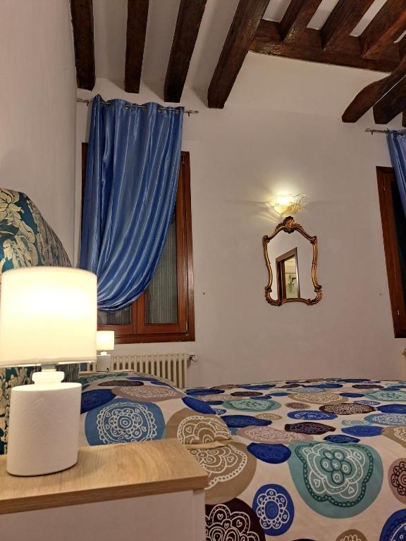 Postel nebo postele na pokoji v ubytování Locanda Ca' Formosa