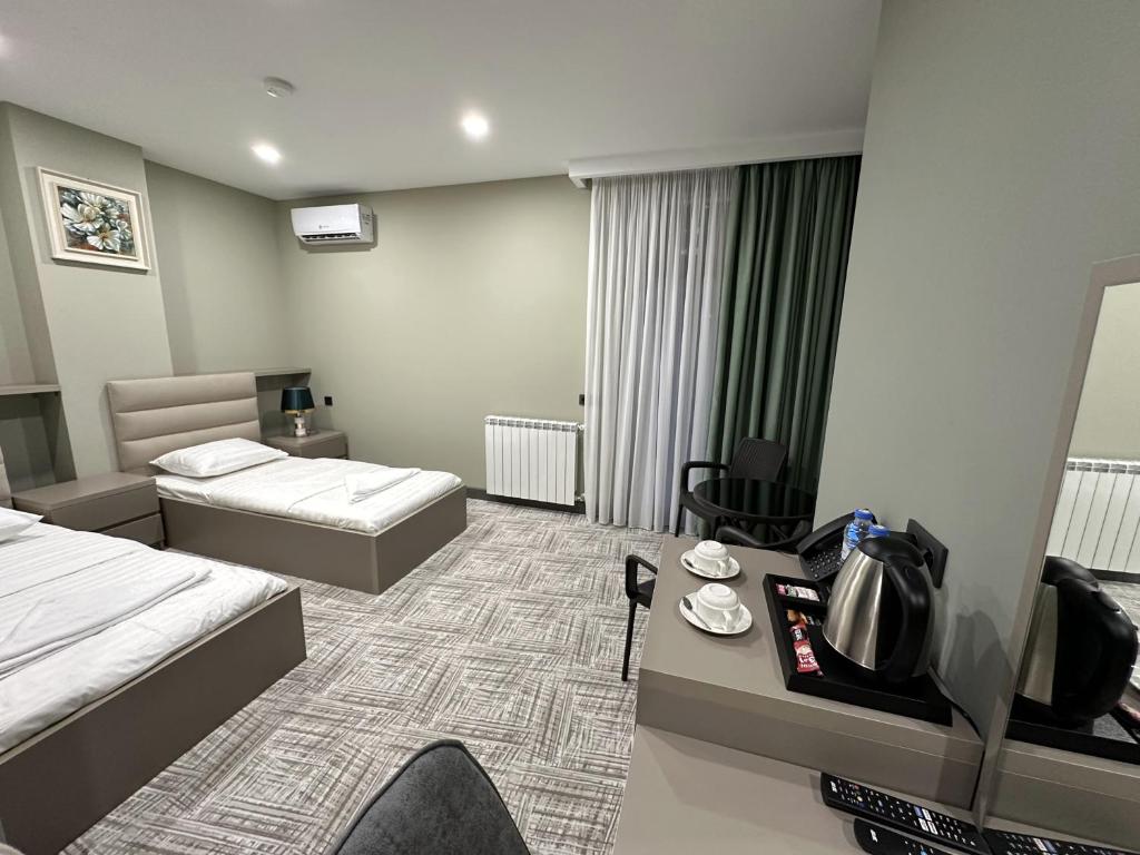 Postel nebo postele na pokoji v ubytování Caspian VF Hotel