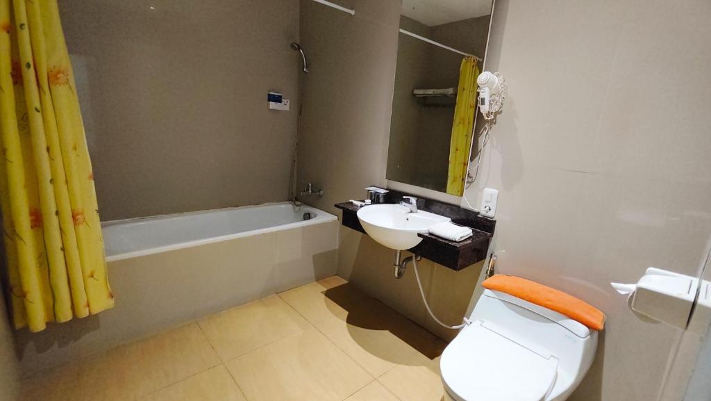 Koupelna v ubytování Odaita Hotel Pamekasan Madura