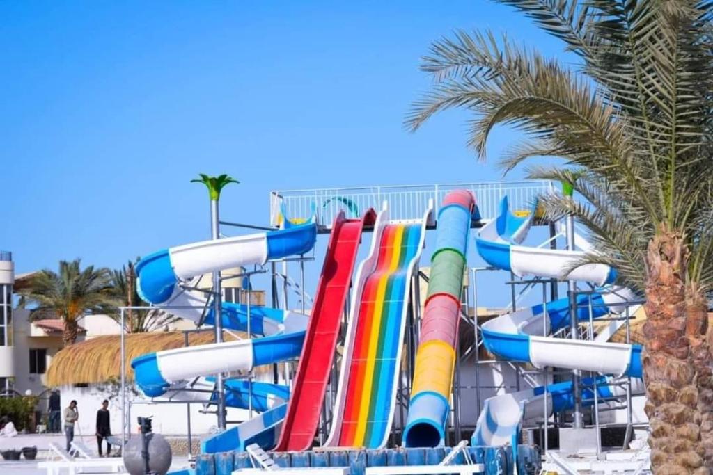 a water park with a colorful water slide at Fanadir Resort 306 Albatross in Hurghada