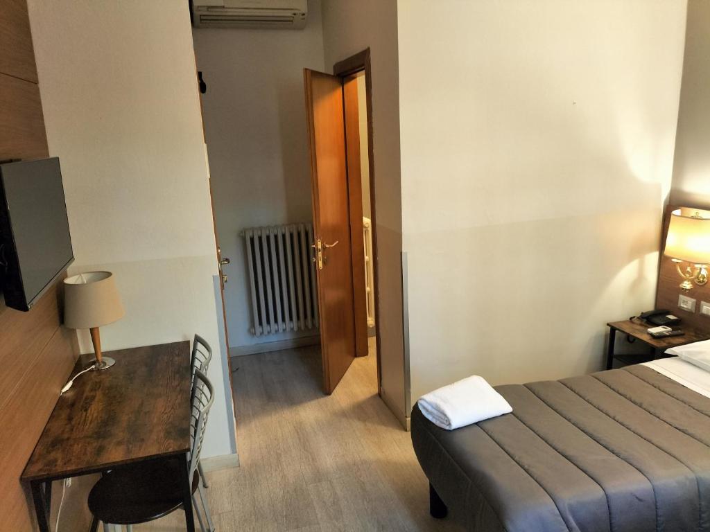 Postel nebo postele na pokoji v ubytování Hotel MM Dateo