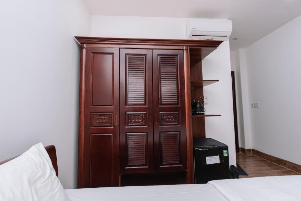 Postel nebo postele na pokoji v ubytování Nguyên Hương Hotel