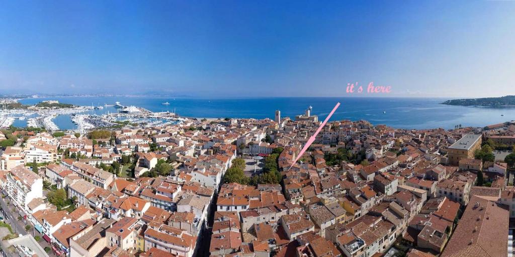 an aerial view of a city and the water at Freshly tastefully renovated apartments in heart of old Antibes in Antibes