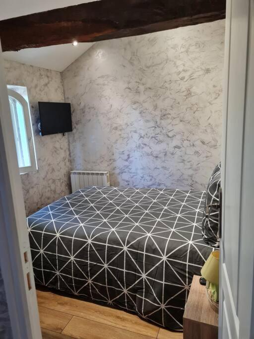 Postel nebo postele na pokoji v ubytování PETIT GÎTE 18 ème tout confort