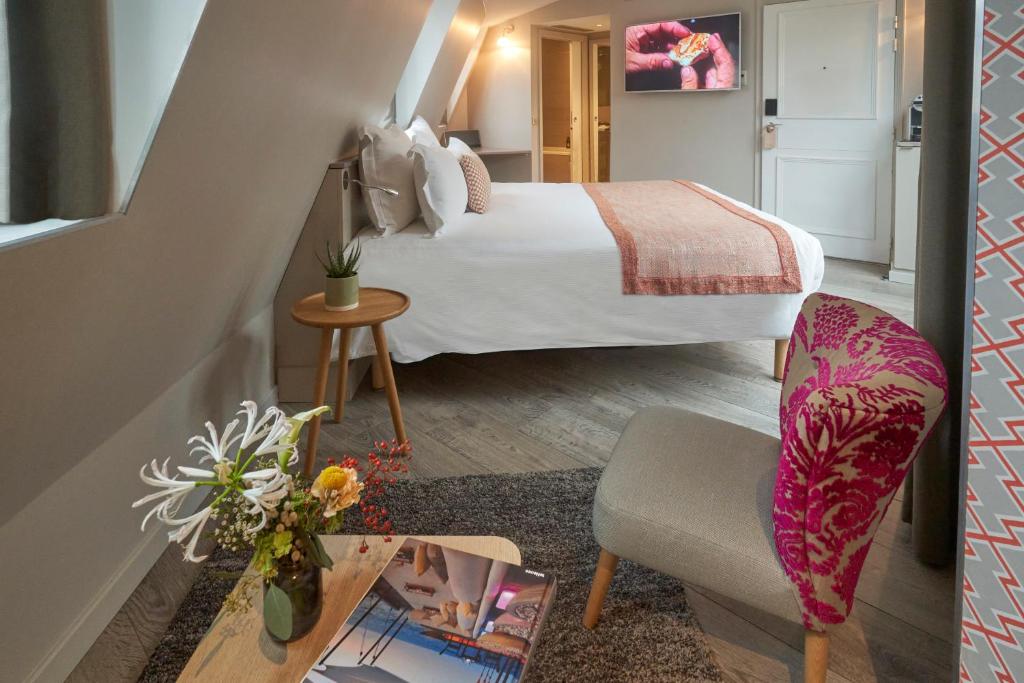 Postel nebo postele na pokoji v ubytování Hôtel Vic Eiffel