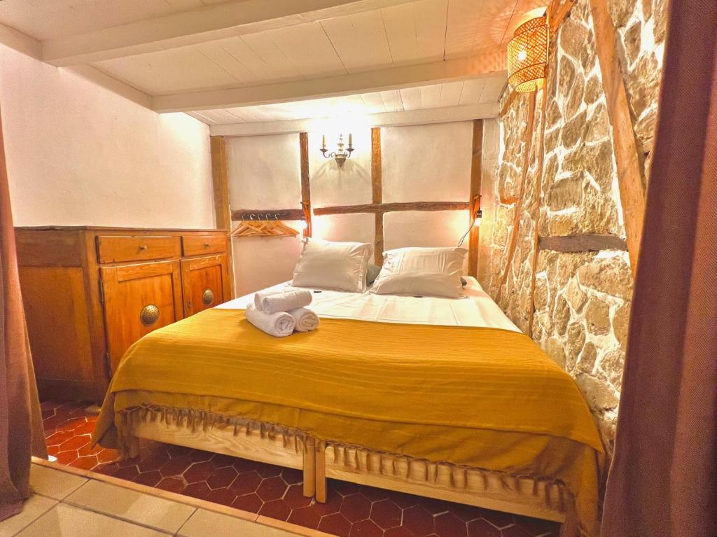 a bedroom with a bed with a towel on it at ApartHotel Riviera - CCC OT Loft du Chateau Old Town Prom des Anglais in Nice