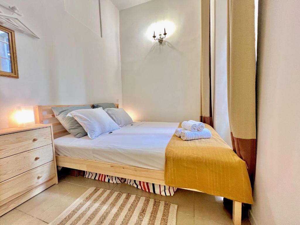 a small bedroom with a bed and a dresser at ApartHotel Riviera - CCC OT Loft du Chateau Old Town Prom des Anglais in Nice