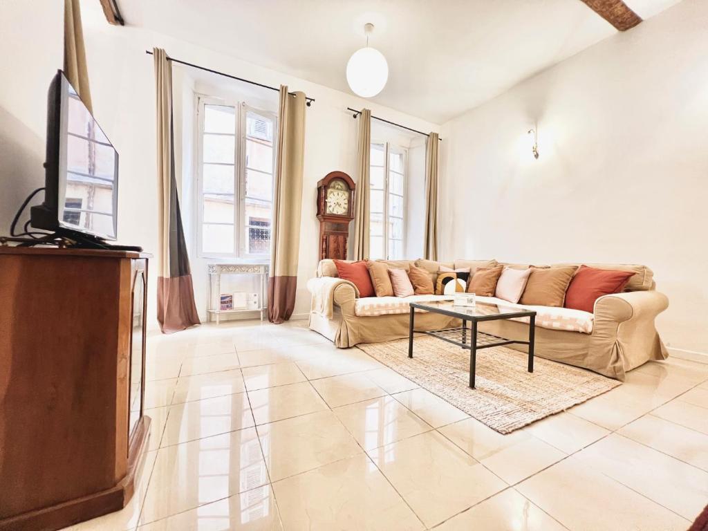 a living room with a couch and a table at ApartHotel Riviera - CCC OT Loft du Chateau Old Town Prom des Anglais in Nice