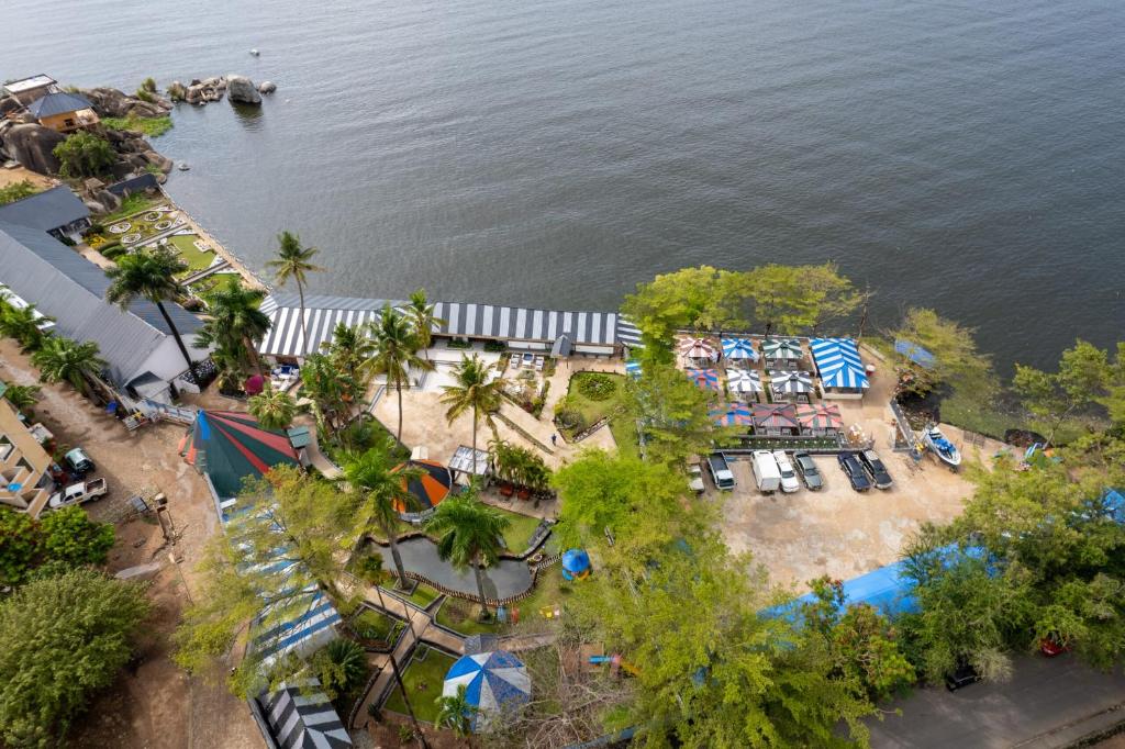 an overhead view of a park with a beach and the water at Rusty Rock Beach Resort & Spa in Mwanza