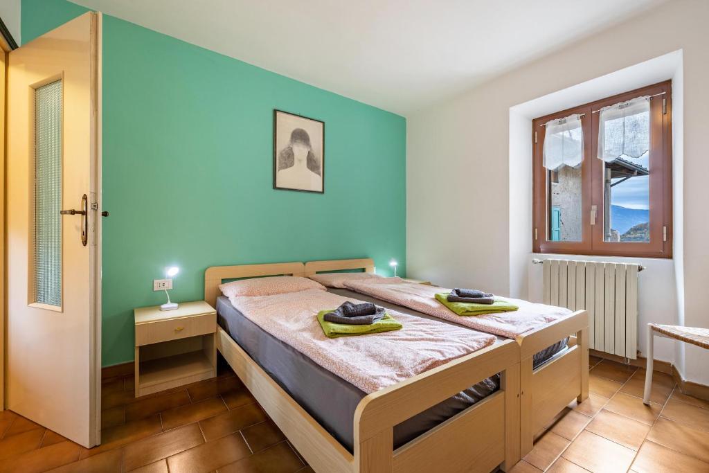 Krevet ili kreveti u jedinici u okviru objekta Casa Luisa Lake Garda