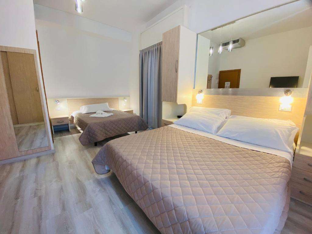 Postel nebo postele na pokoji v ubytování Hotel Butterfly Wellness & Spa