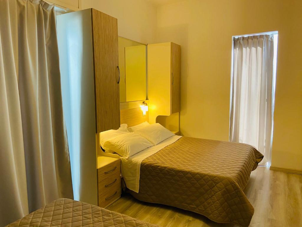Postel nebo postele na pokoji v ubytování Hotel Butterfly Wellness & Spa