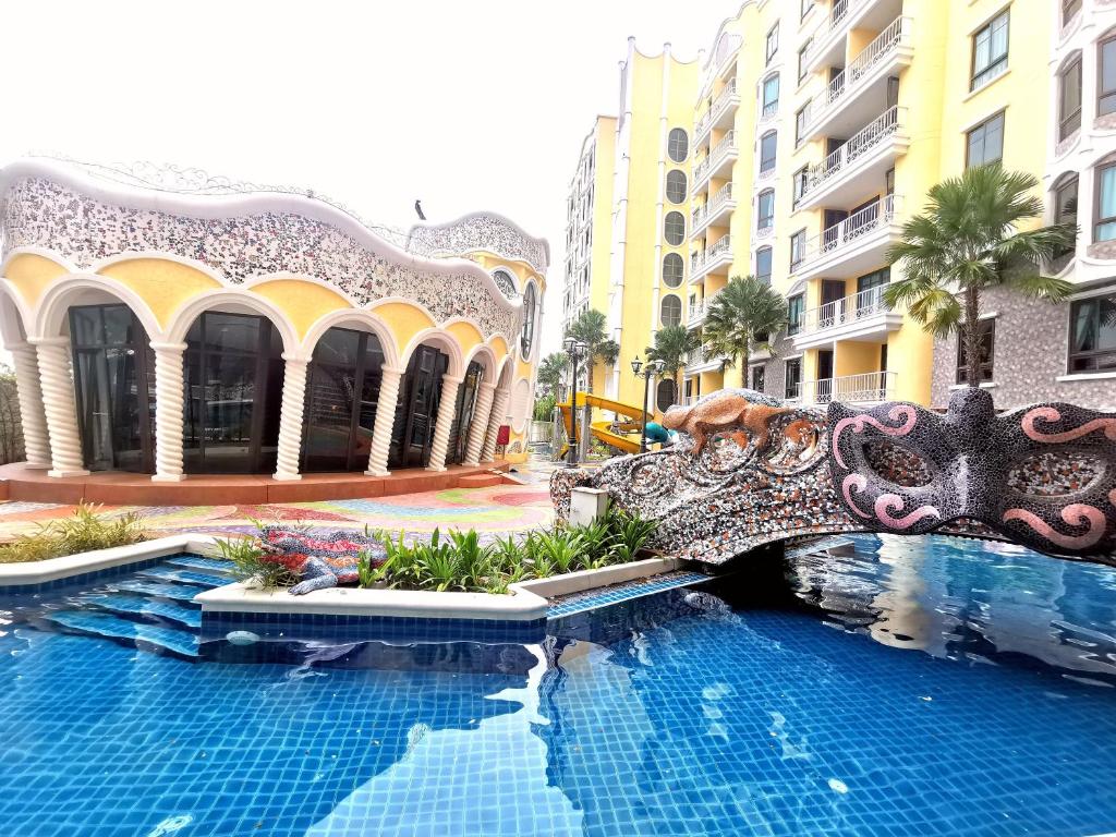 a view of a swimming pool at a resort at G63 Pool access room Espana Condo Resort Pattaya in Jomtien Beach