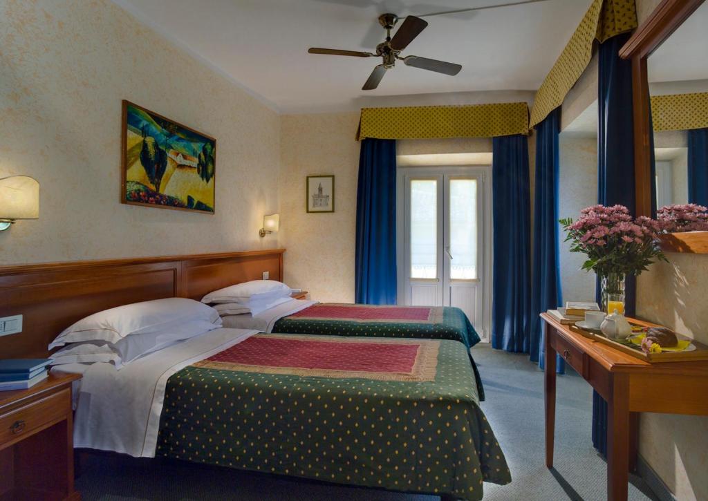 Postel nebo postele na pokoji v ubytování Hotel Garnì Riviera