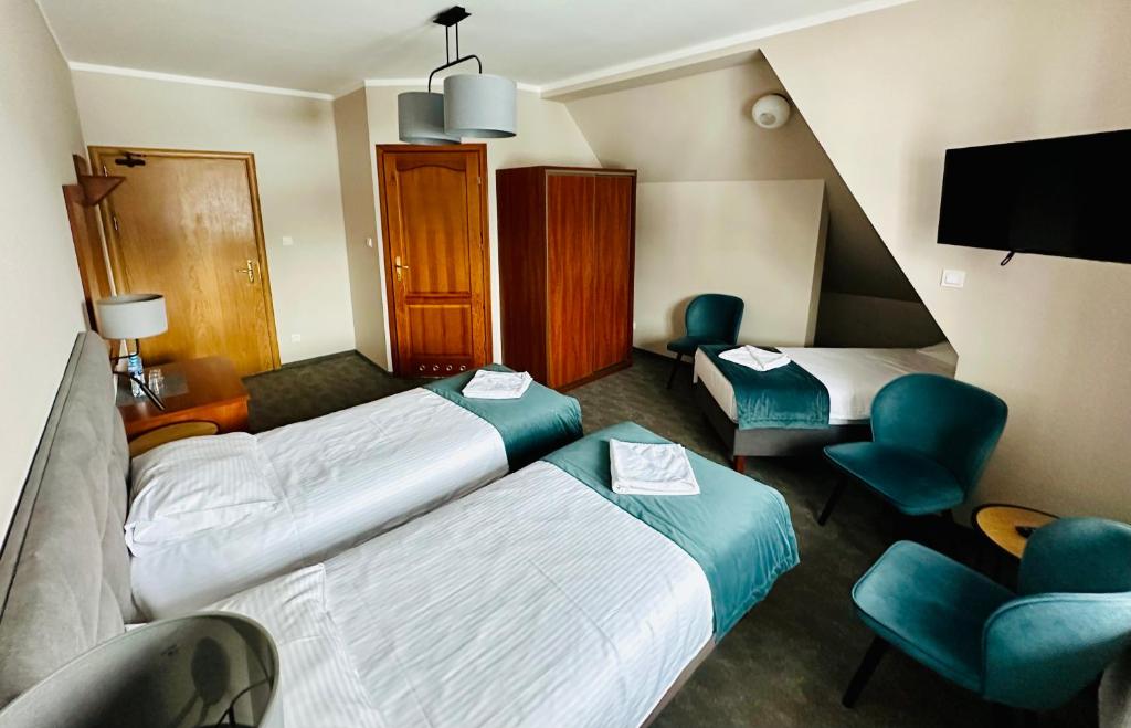 Postel nebo postele na pokoji v ubytování GórSKI SPA Karpacz I dawniej APOLLO
