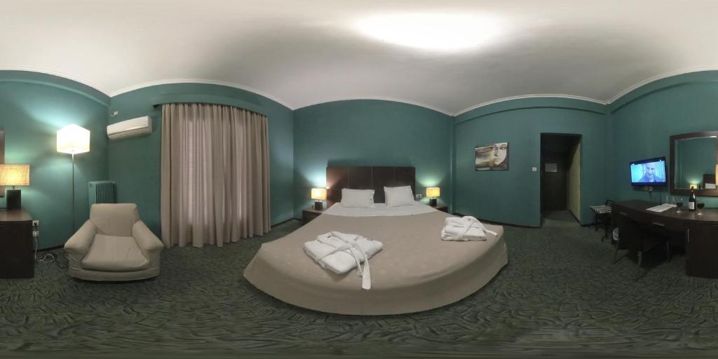 Postel nebo postele na pokoji v ubytování Galini Hotel