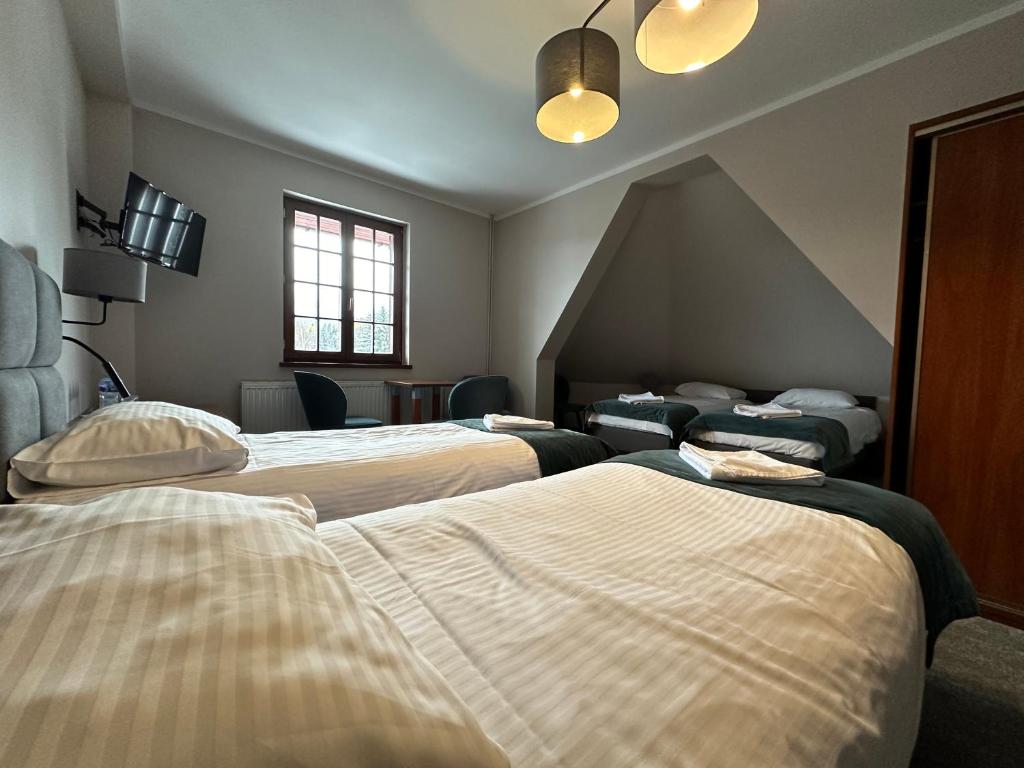 Postel nebo postele na pokoji v ubytování GórSKI SPA Karpacz I dawniej APOLLO