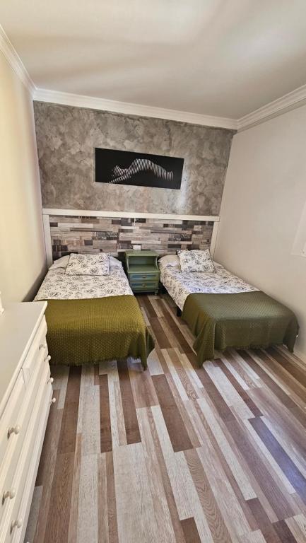Postel nebo postele na pokoji v ubytování Apartamentos GARAKOTA
