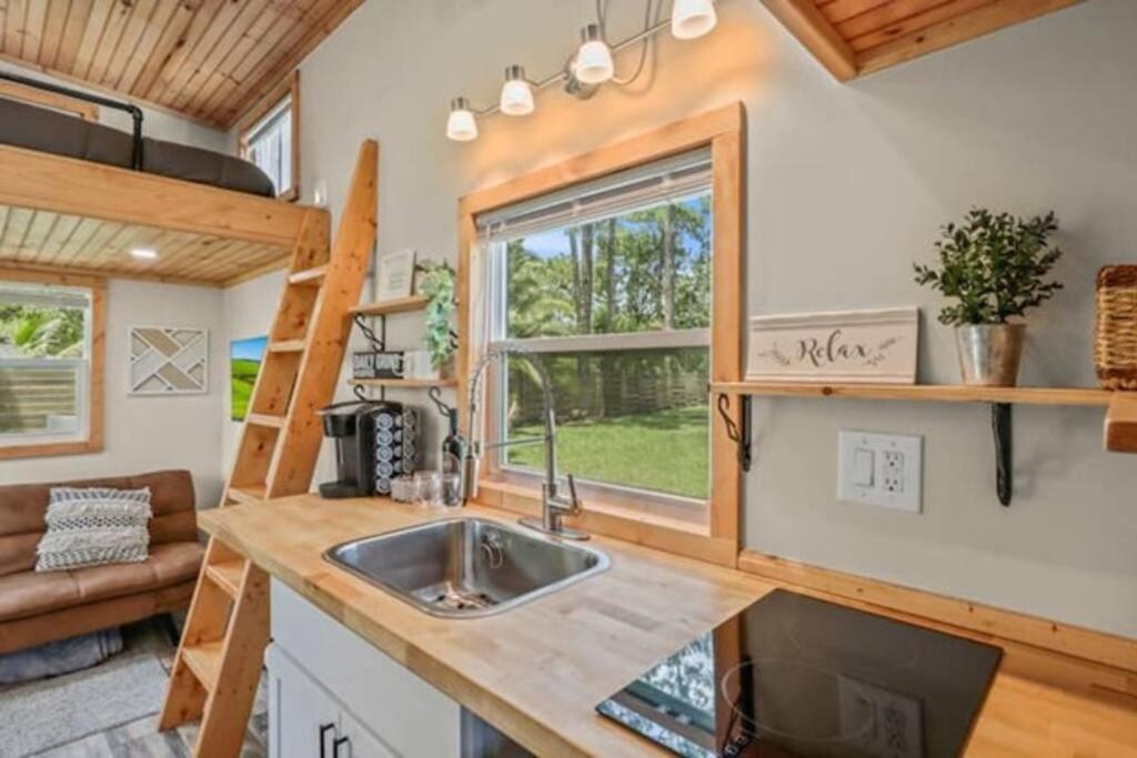 a kitchen with a sink in a tiny house at Summer Tiny House in West Palm Beach