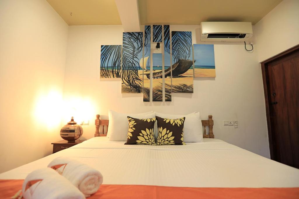 Postel nebo postele na pokoji v ubytování D Plus Resort Negombo