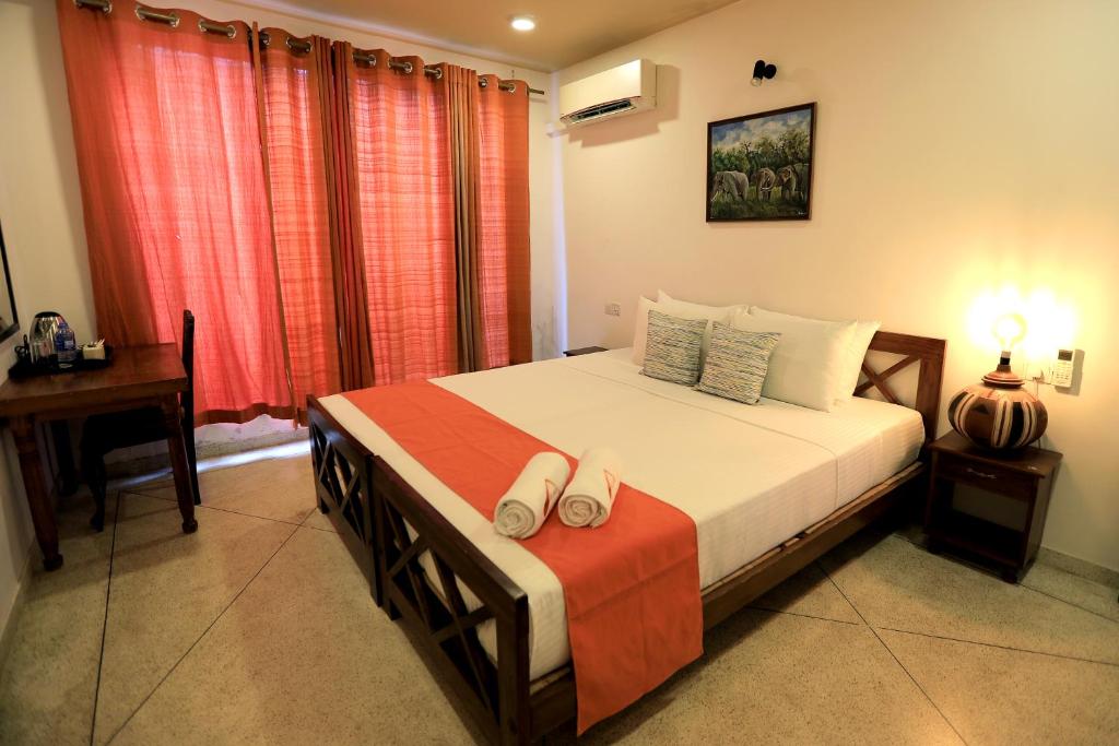 Postel nebo postele na pokoji v ubytování D Plus Resort Negombo