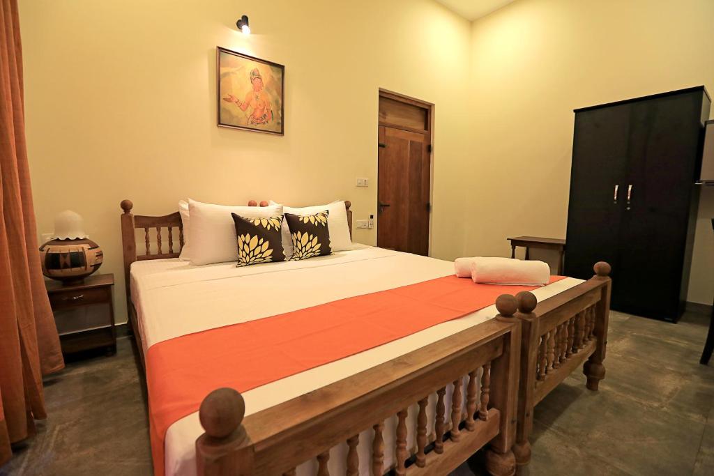 Postel nebo postele na pokoji v ubytování D Plus Resort Negombo