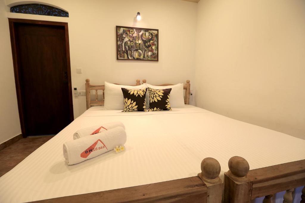 Postel nebo postele na pokoji v ubytování D Plus Resort Negombo