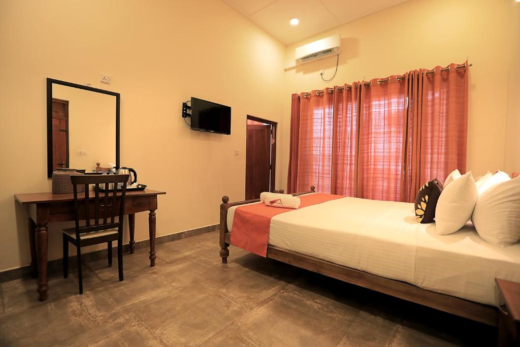 Postel nebo postele na pokoji v ubytování D Plus Resort Negombo