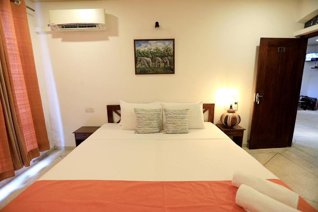Postel nebo postele na pokoji v ubytování D Plus Resort Negombo