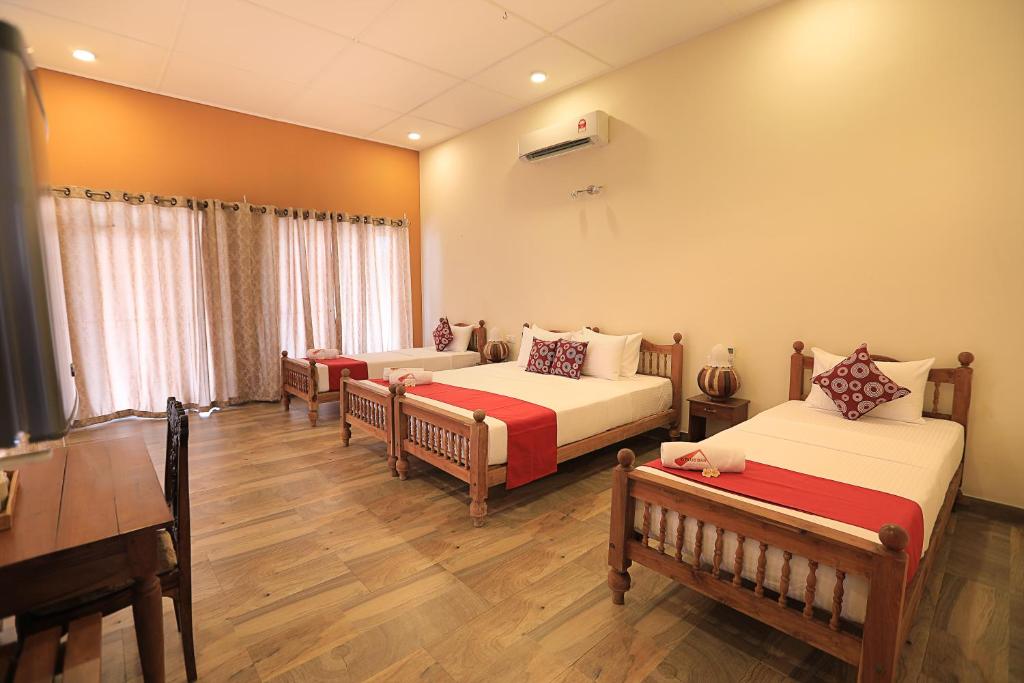 Postel nebo postele na pokoji v ubytování D Plus Resort Negombo