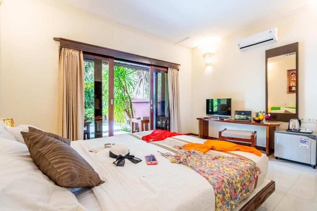 Postel nebo postele na pokoji v ubytování Senang Villa Gili Air