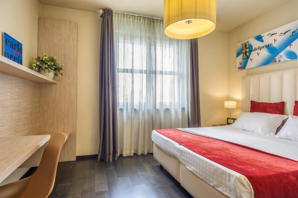 Postel nebo postele na pokoji v ubytování Hotel San Marco
