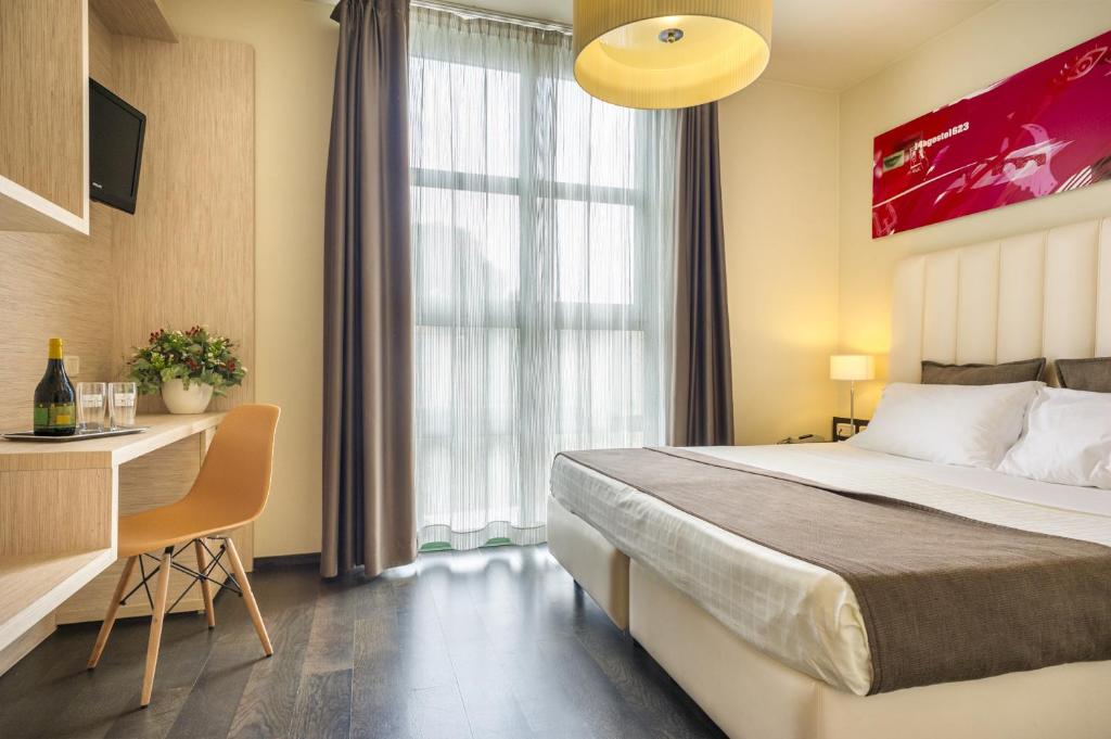 Postel nebo postele na pokoji v ubytování Hotel San Marco