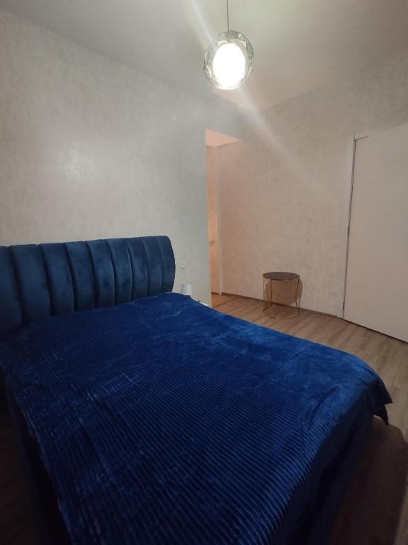 Postel nebo postele na pokoji v ubytování Guest House Mtisubani