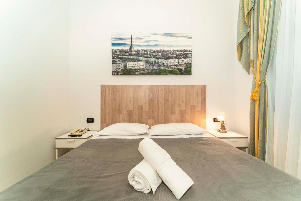 Postel nebo postele na pokoji v ubytování Hotel Cristallo Torino