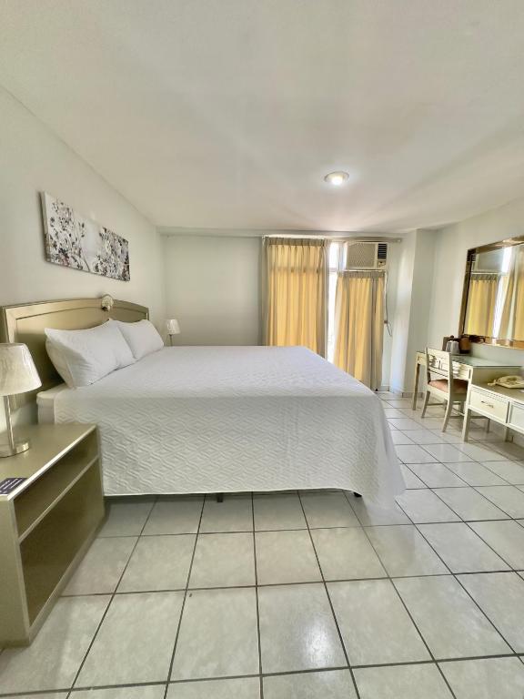 Postel nebo postele na pokoji v ubytování Gran Hotel Paris