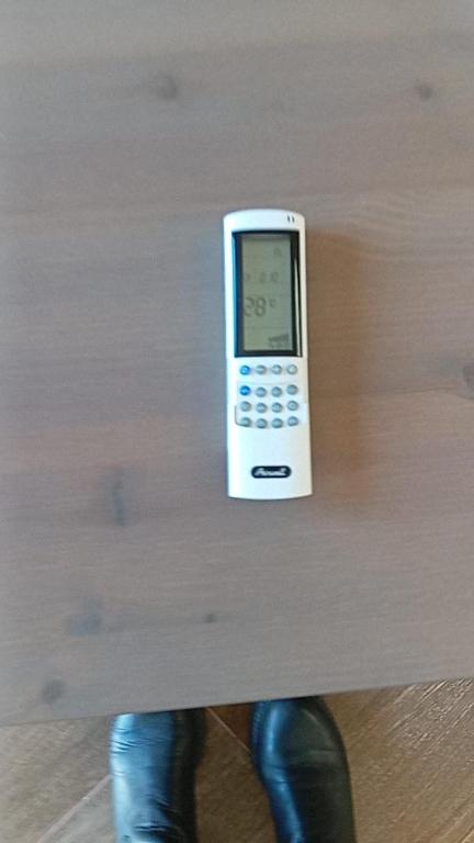 a cell phone sitting on top of a table at 2BD Bugibba Penthouse Triq l-Isponoz in St. Paul's Bay