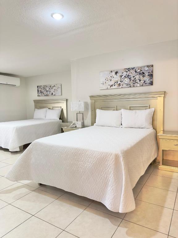 Postel nebo postele na pokoji v ubytování Gran Hotel Paris