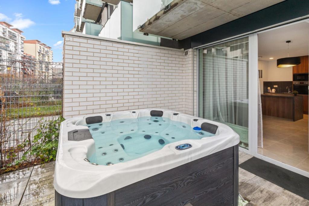 a hot tub in the backyard of a house at LAM Jegeho Alej w Jacuzzi & Free Parking in Bratislava