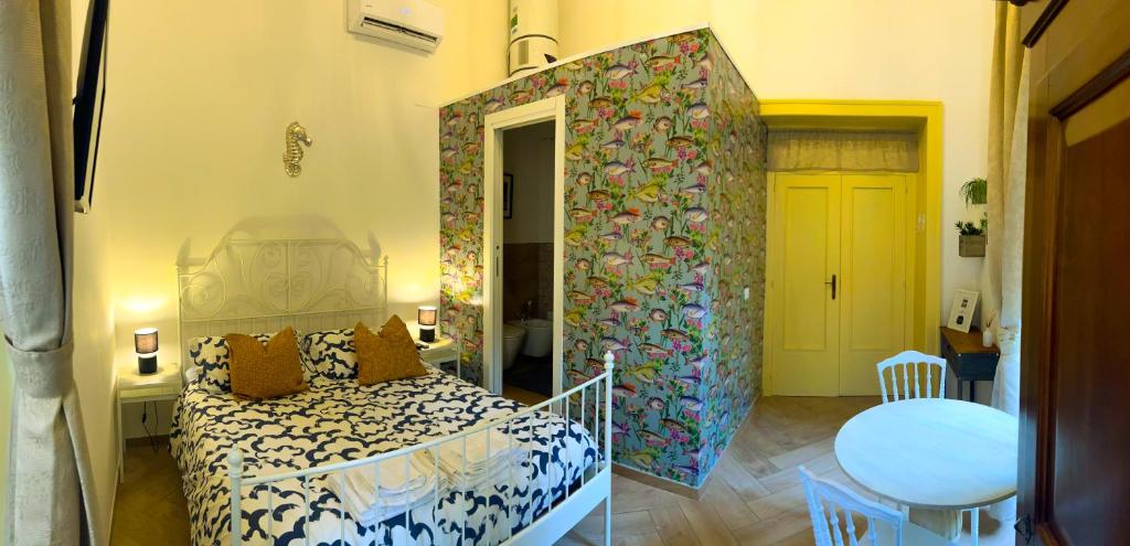 A bed or beds in a room at Il Salernitano Bed and Breakfast