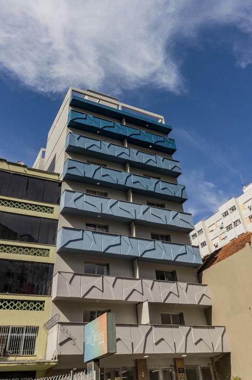 a tall building with balconies on the side of it at Duque by My Way - 100 meters from Santa Casa and UFRGS in Porto Alegre