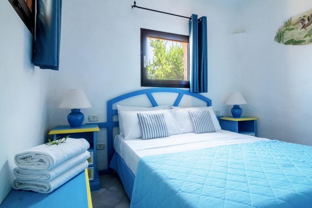 Postel nebo postele na pokoji v ubytování Residence I Cormorani Bis