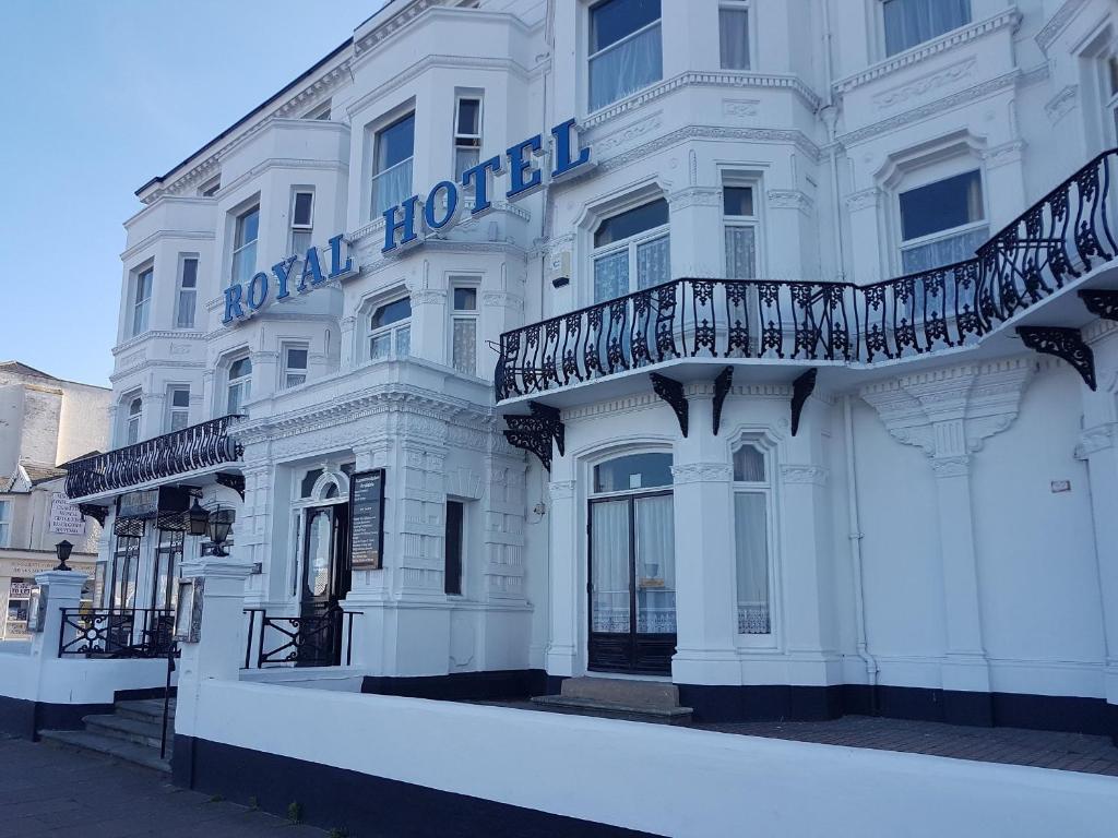 a white building with a sign on it at Royal Hotel Great Yarmouth in Great Yarmouth