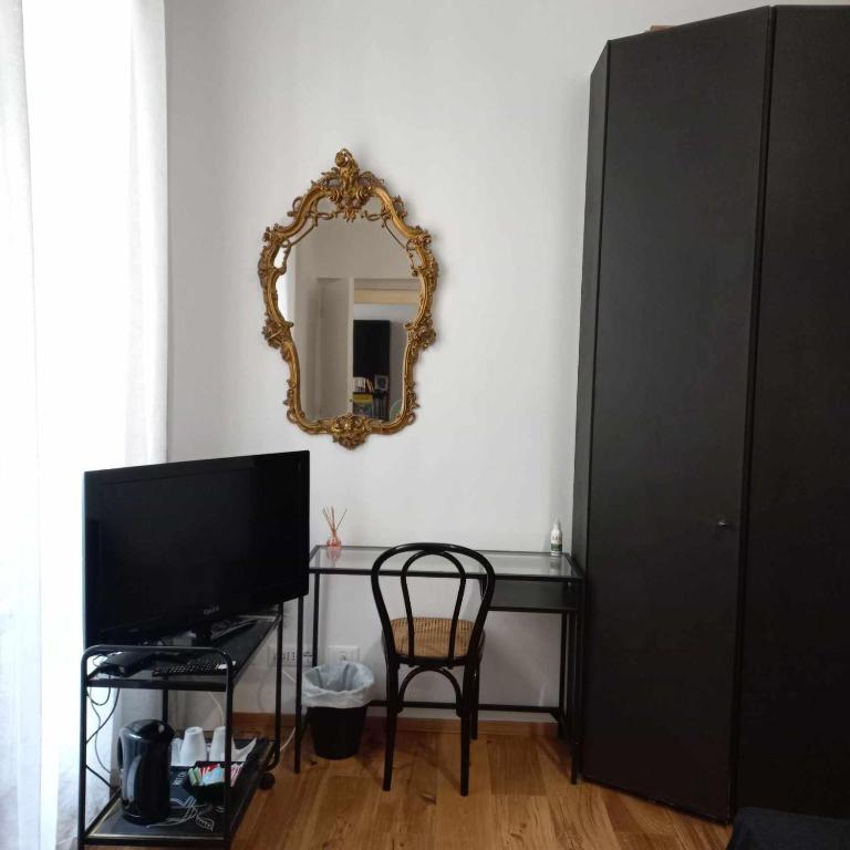 TV a/nebo společenská místnost v ubytování Genoa Waterfront Room