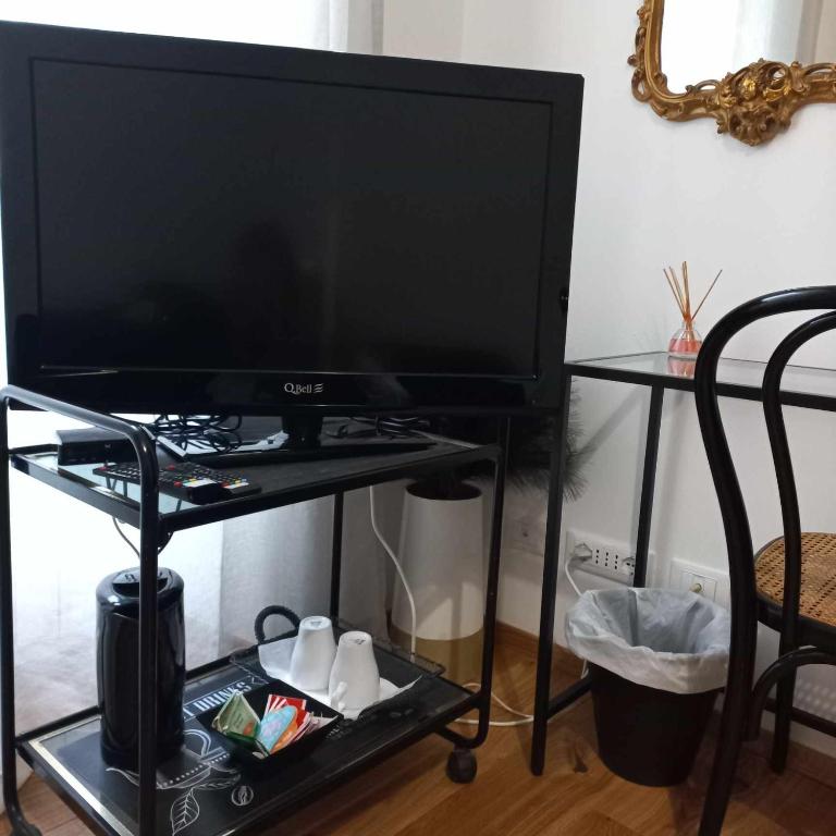 TV a/nebo společenská místnost v ubytování Genoa Waterfront Room